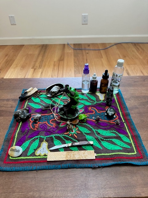 Kambo altar arranged indoors with sacred tools and medicines