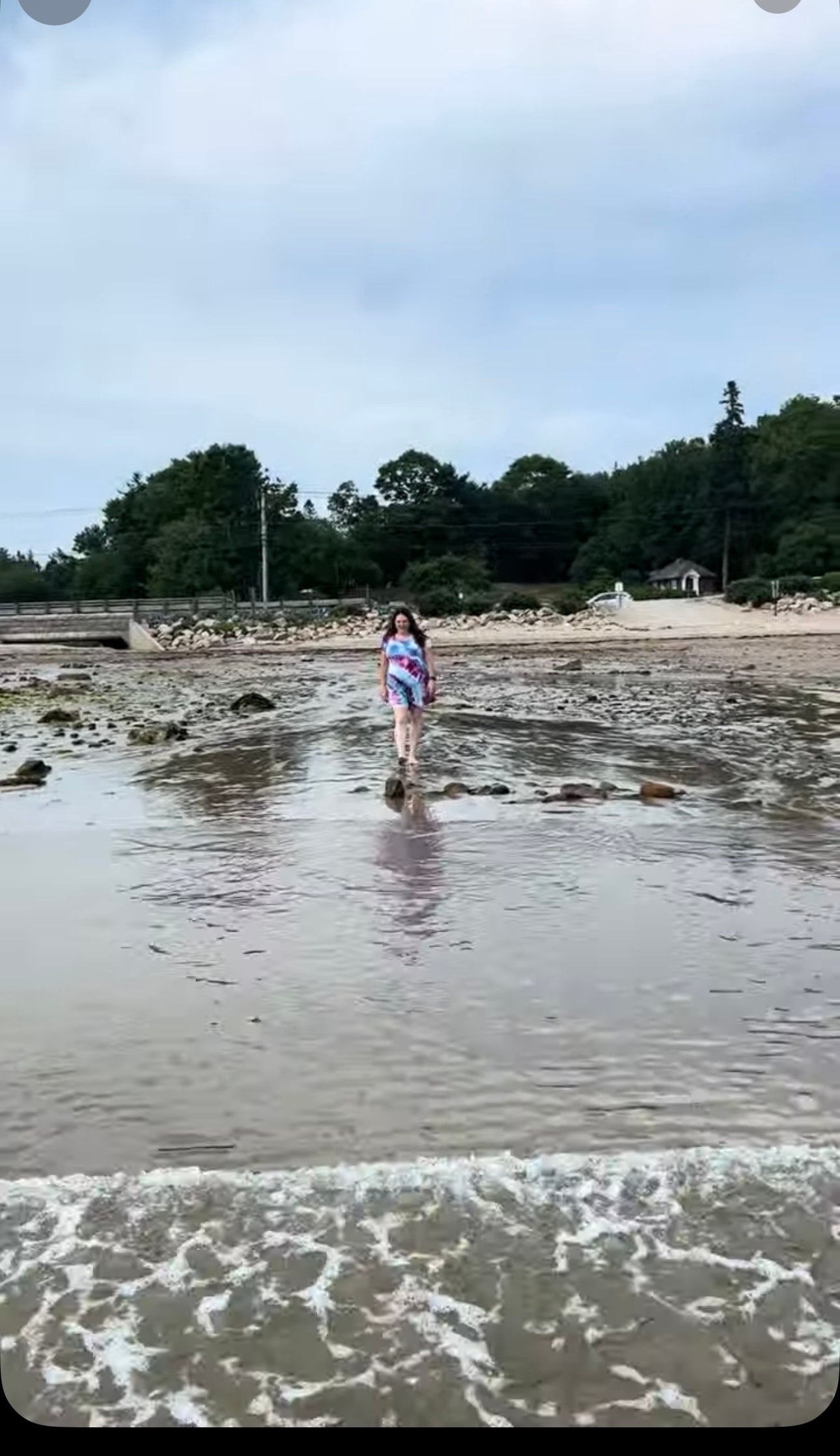 Angela wading in shallow beach water